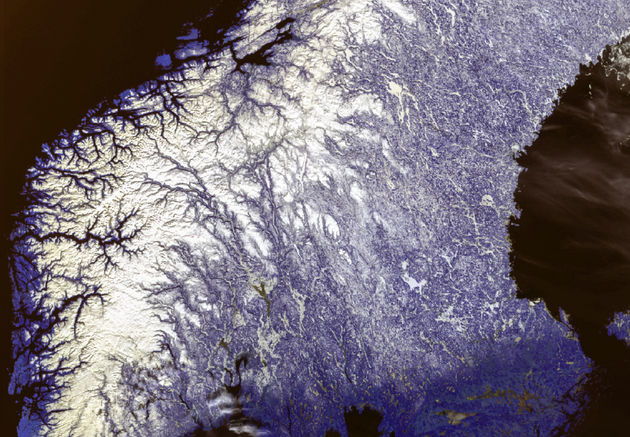 This is a satellite image of central Norway and Sweden showing snow cover. The image colours are black, various shades of blue and purple, and of course white.
